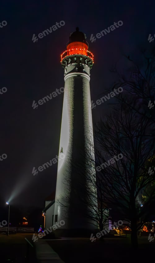 Preview: Windpoint Lighthouse illuminated by a bright red light at night