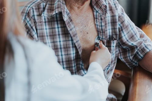 Preview: Doctor uses stethoscope to check patient's heartbeat