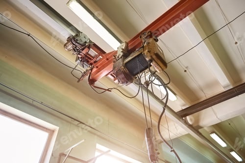 Gritty Industrial Crane in a Factory Setting