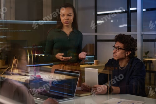 Preview: IT Specialists Working On Project In Evening