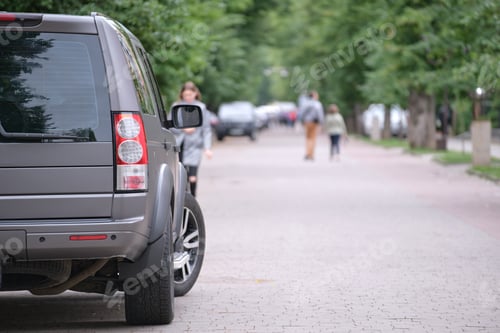 Preview: Close up of a car parked on city street side. Urban traffic concept