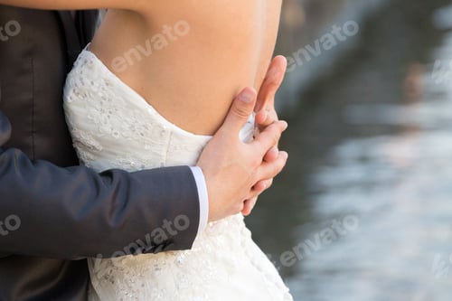 Preview: Married couple embraced, detail of the bust and arms