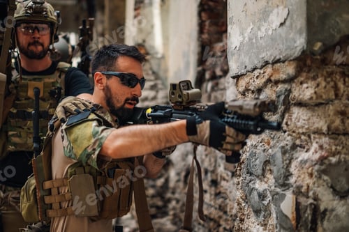 Preview: Soldier with rifle aiming at opponent in ruined building.