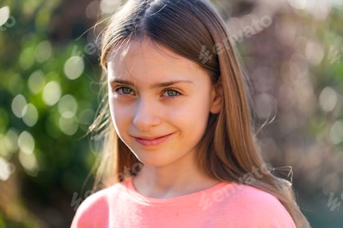 Preview: Portrait of smiling girl in the garden