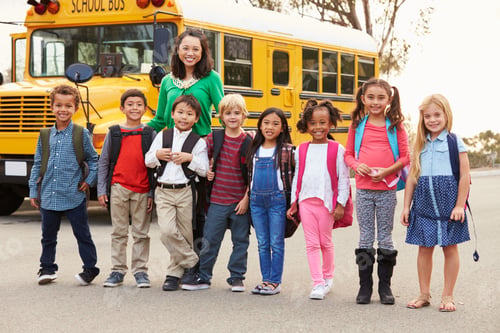 Preview: Teacher and a group of elementary school kids at a bus stop