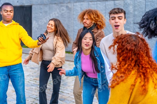 Preview: Friends listening to music and dancing in the street