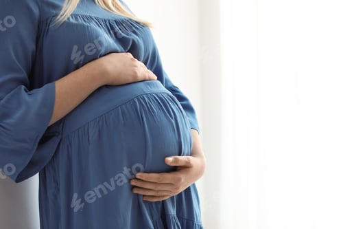 Preview: Pregnant woman on light background, closeup. Space for text