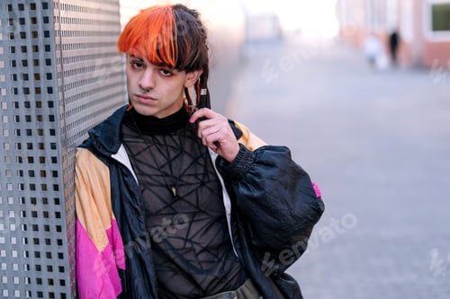 Preview: Portrait of a boy with urban appearance with painted hair.