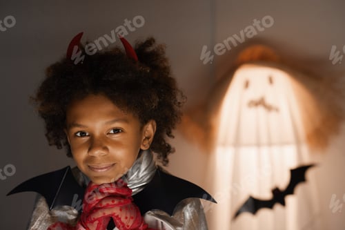 Preview: Dreamy Afro-American boy in Halloween dress