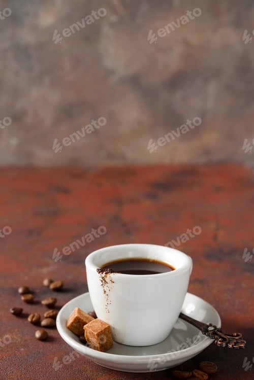 Preview: White coffee cup and coffee beans on old background