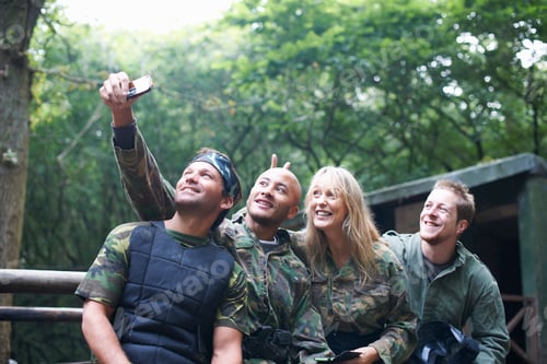 Preview: Paintball players taking a picture of themselves