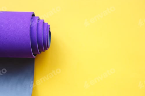 Preview: Purple Rolled Exercise Mat on Yellow Background
