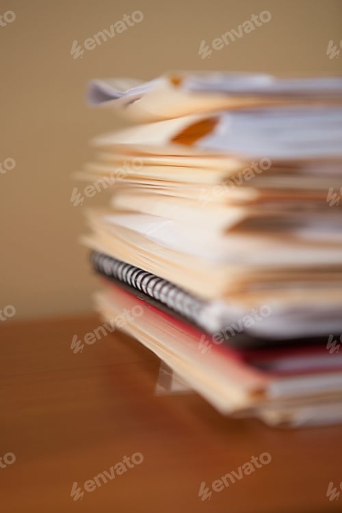 Preview: Close up of stack of paperwork and files on office desk