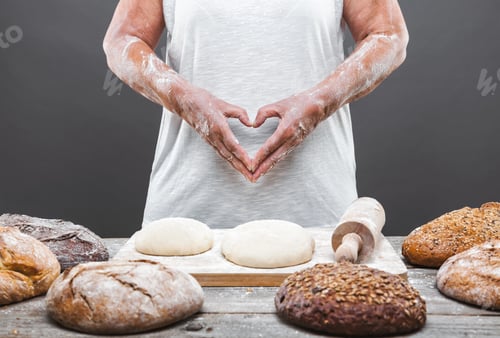 Preview: Baker preparing delicious fresh bread and pastry