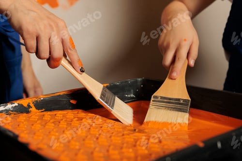 Preview: Mother and girl holding paintbrush in can