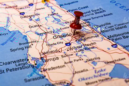 Preview: Closeup shot of a traveling red push pin on a map on the city of Orlando