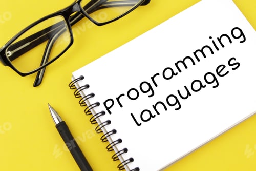 Preview: blank paper with inscription programming languages on a yellow background