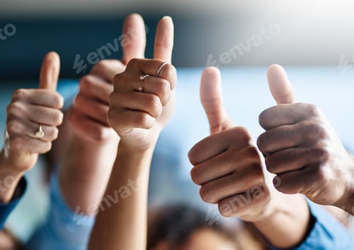Preview: Shot of a group of creative businesspeople giving thumbs up while standing in their office