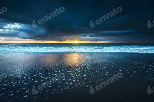 Preview: Stormy sea waves and foam at sunset. Marina di Cecina beach, Tuscany, Italy.