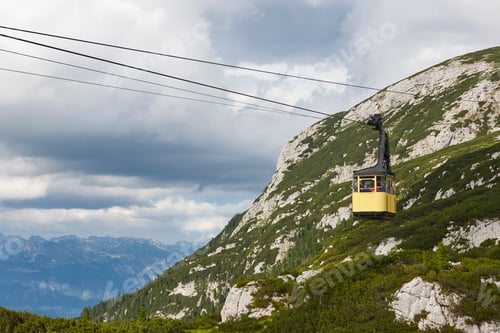 Preview: Picturesque yellow cable car in Dachstein mountain range. Austria