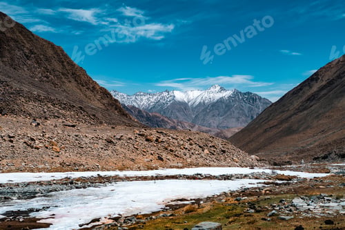 Preview: Majestic snow-capped Himalayan mountains near Leh under clear blue sky, natural landscape