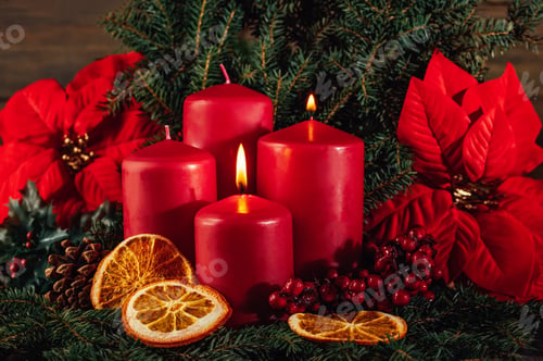 Preview: Two burning Red advent candles in advent wreath decoration on wooden dark background