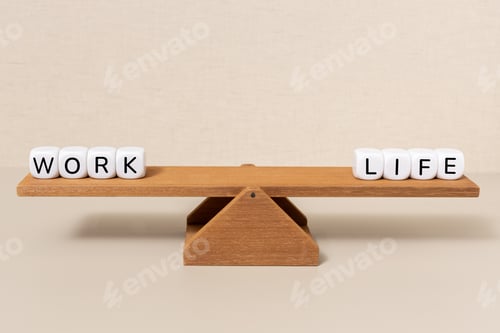 Preview: Work and life words balancing perfectly on a wooden seesaw representing equilibrium