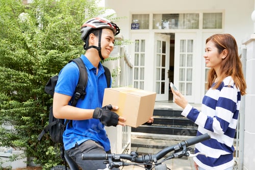 Preview: Happy woman receiving package