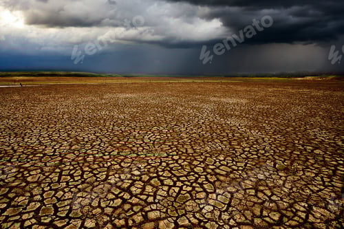 Preview: Cracked Earth Landscape with Stormy Sky Background