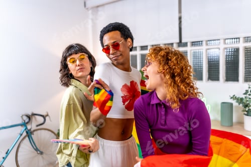 Preview: Friends celebrating diversity partying at home with lgbt flag