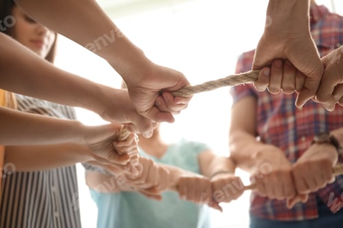 Preview: People holding rope together on light background, closeup of hands. Unity concept
