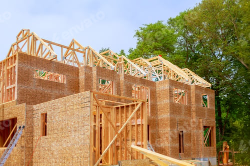 Preview: Unfinished interior of a newly built house with wooden stud timber framing