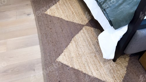 Preview: Modern Bedroom Detail Showcasing Geometric Rug and Contemporary Furniture