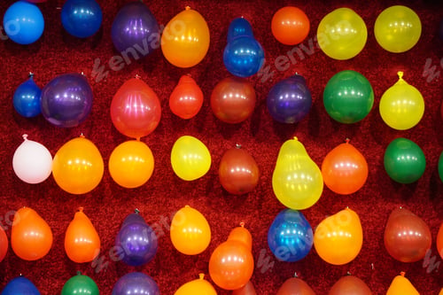 Preview: Cheerful scene of colorful balloons at an outdoor carnival