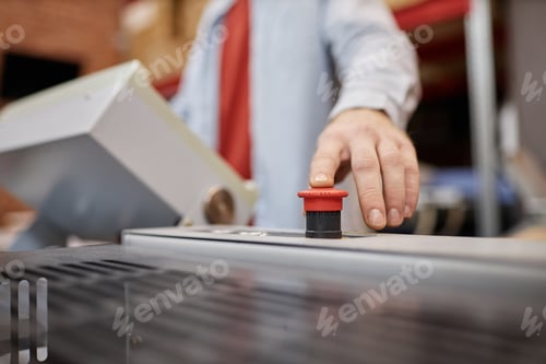 Preview: Worker Pressing Red Button Closeup