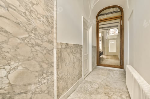 Preview: a hallway with marble walls and a mirror and a