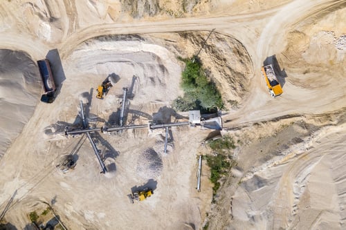 Preview: Open pit mining of construction sand stone materials with excavators and dump trucks at conveyor
