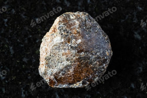 Preview: sample of rough brown titanite mineral on black