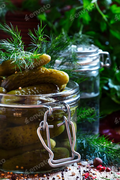 Preview: Marinated gherkins, spices, vinegar, vintage wooden background, selective focus