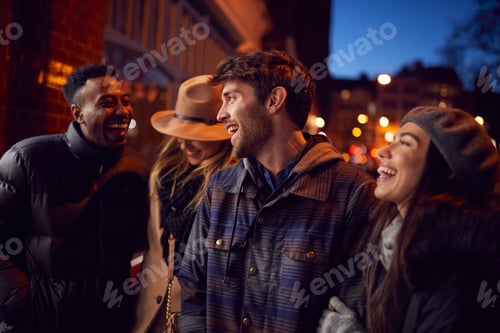Preview: Group Of Friends In City Outdoors On Night Out Together