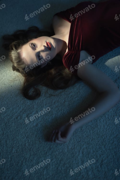 Preview: Dead Woman With Blonde Hair In Red Dress On White Carpet.