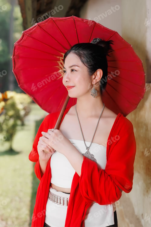 Preview: Northern Thai Chiangmai lanna style beautiful women with paper umbrella at wat ton kwen
