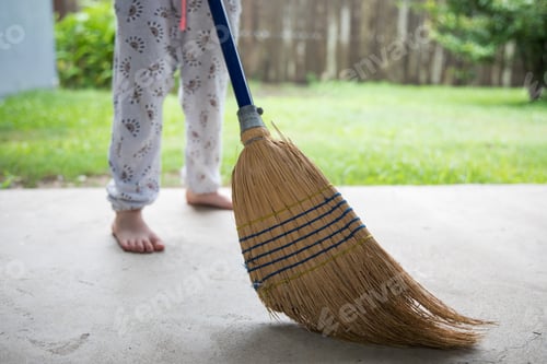 Preview: Young girl helping at home