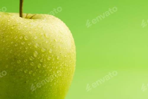Preview: Close up of green apple and copy space on green background
