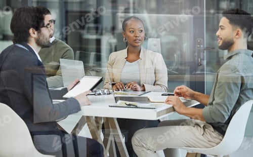 Preview: Shot of a group of businesspeople having a meeting in an office at work