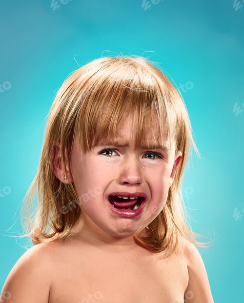 Preview: Portrait of a little girl. She is crying