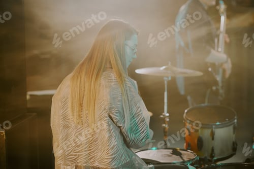 Preview: Blond Woman Playing Drums