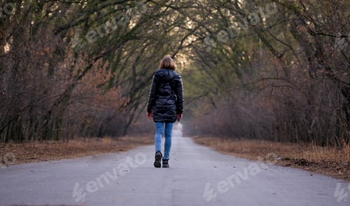 Preview: A woman from behind, open road