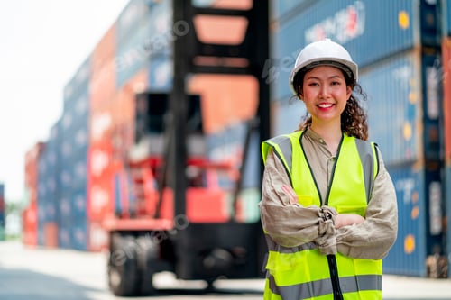 Preview: Portrait of Asian cargo container worker or technician stand with arm crossed and smile to camera