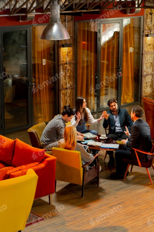 Preview: top shot in large beautiful hall office employees sitting on yellow chairs discuss a deal